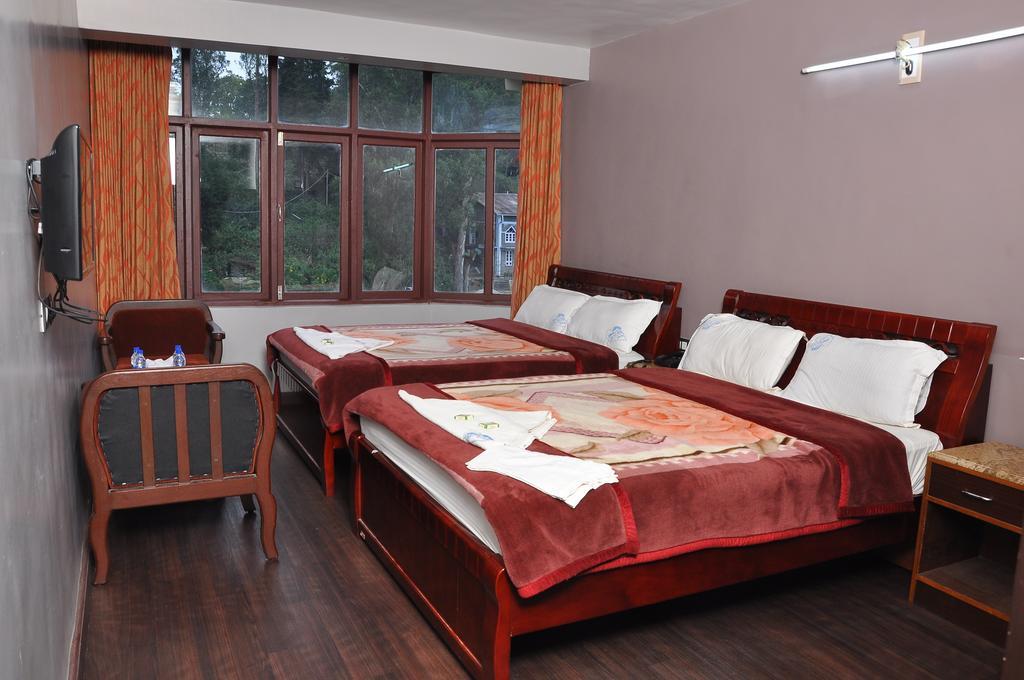 קודאיקנאל Grand Paradise Inn מראה חיצוני תמונה
