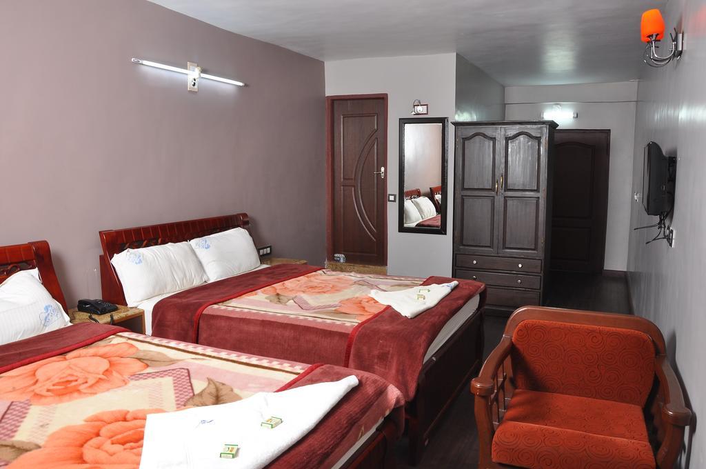 קודאיקנאל Grand Paradise Inn מראה חיצוני תמונה