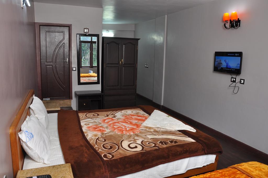 קודאיקנאל Grand Paradise Inn חדר תמונה