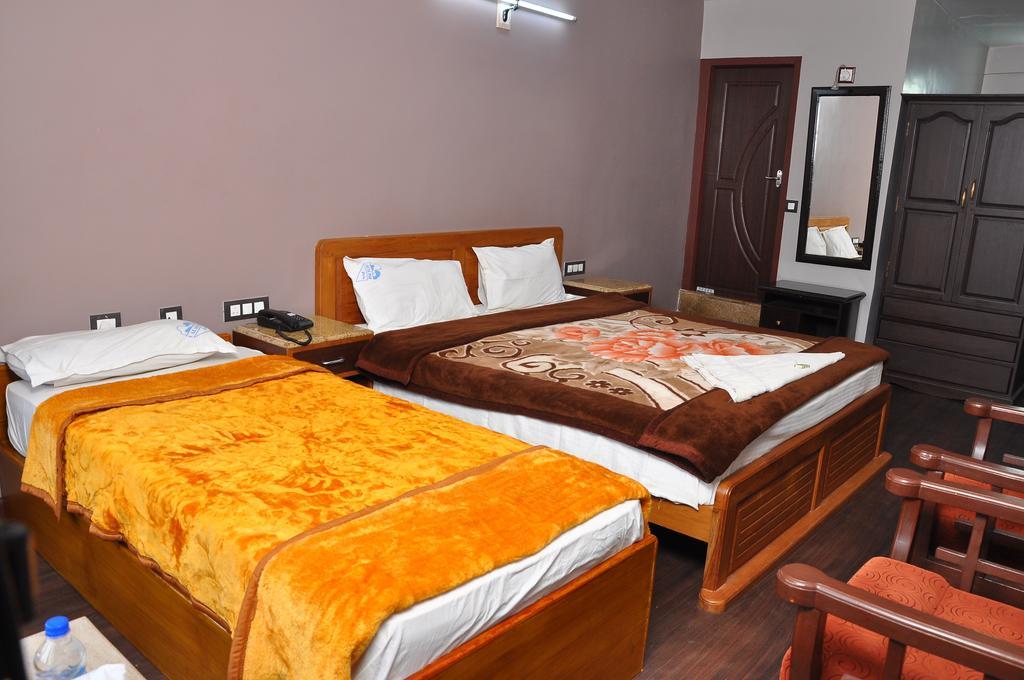 קודאיקנאל Grand Paradise Inn חדר תמונה