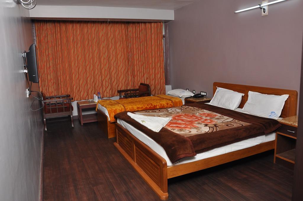 קודאיקנאל Grand Paradise Inn חדר תמונה