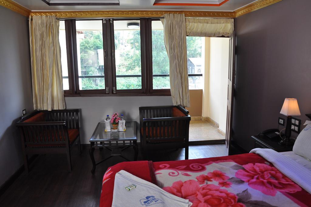 קודאיקנאל Grand Paradise Inn חדר תמונה