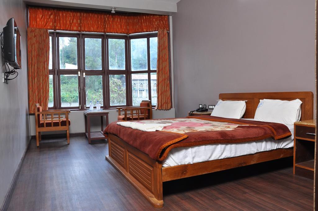 קודאיקנאל Grand Paradise Inn חדר תמונה