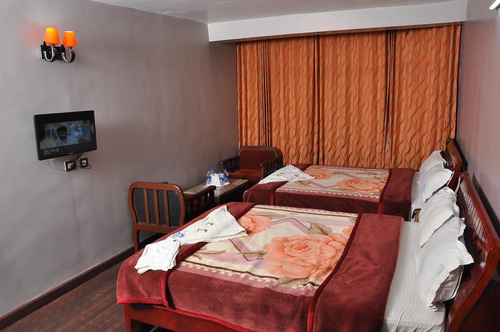 קודאיקנאל Grand Paradise Inn חדר תמונה